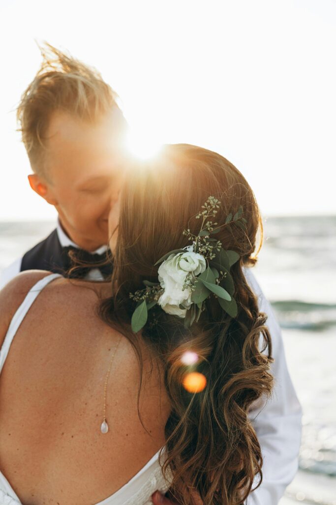 Bride and Groom kissing on the beach at golden hour in Florida