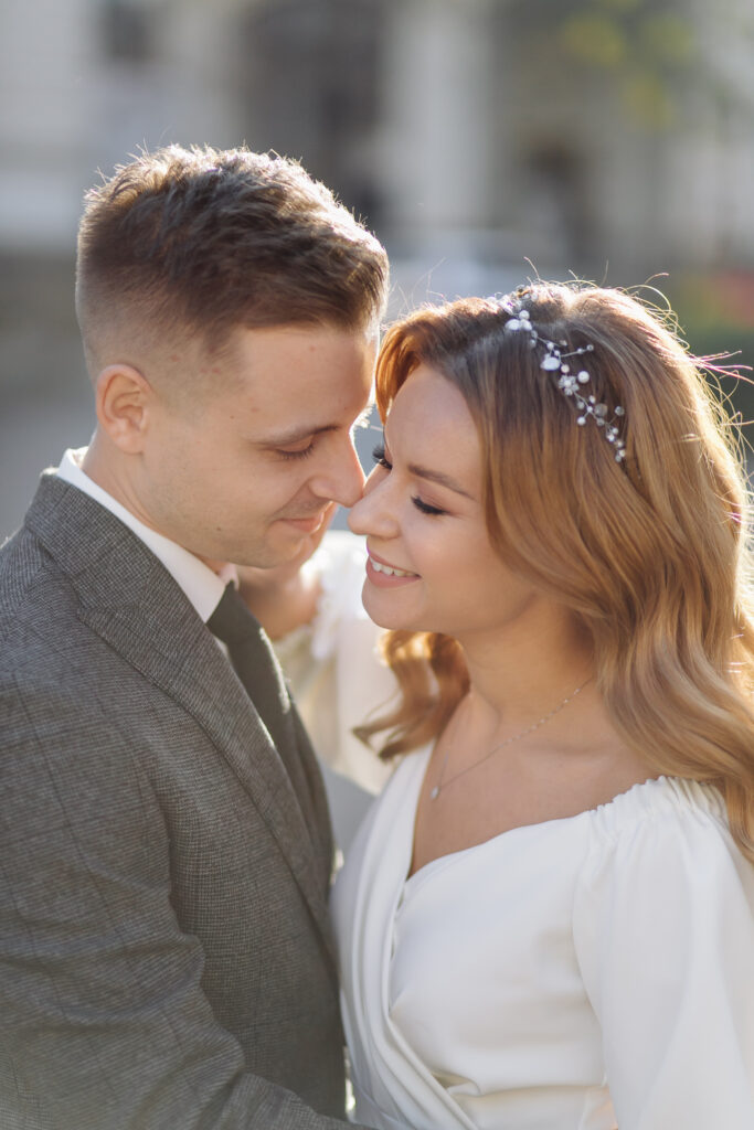 The Ultimate Guide to Choosing the Perfect Wedding Photographer. bride and groom on wedding day nose to nose.