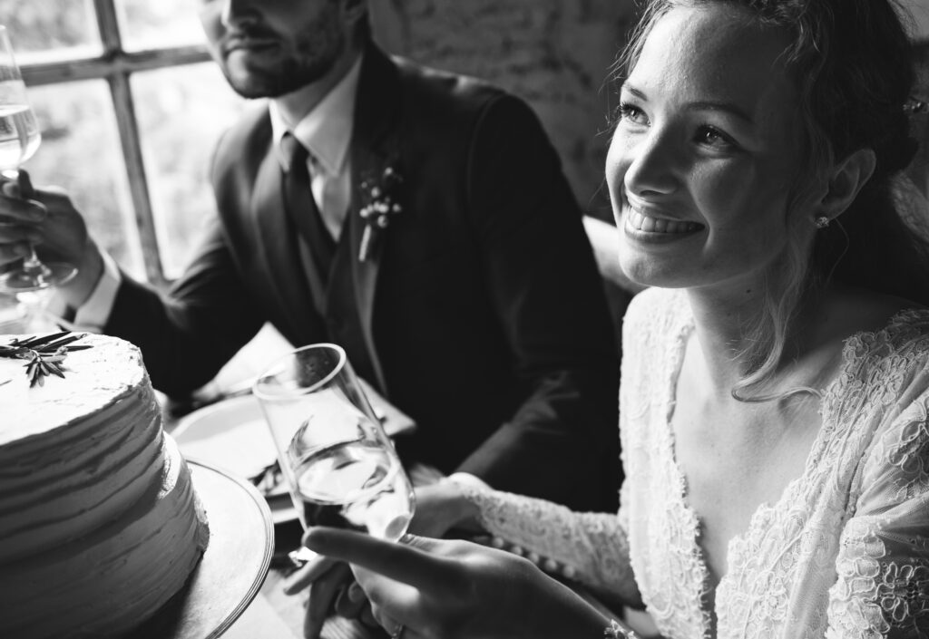 Bride and Groom Cling Wineglasses with Friends on Wedding Reception. The Latest Photography Trends in Wedding Photography