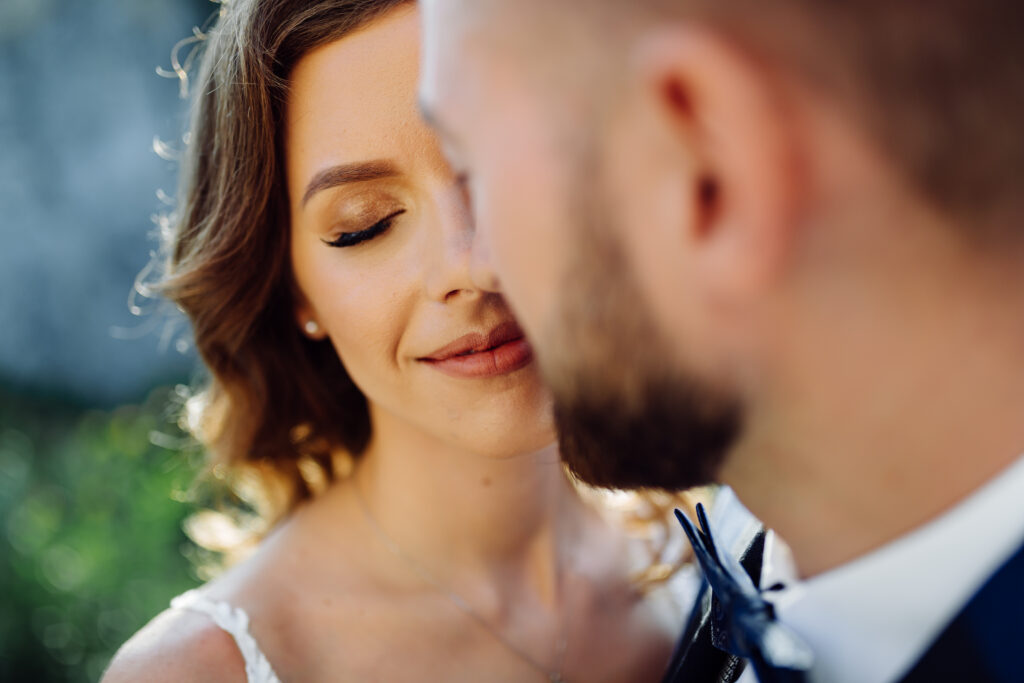 The Ultimate Guide to Choosing the Perfect Wedding Photographer. up close of bride's face with eyes closed.
