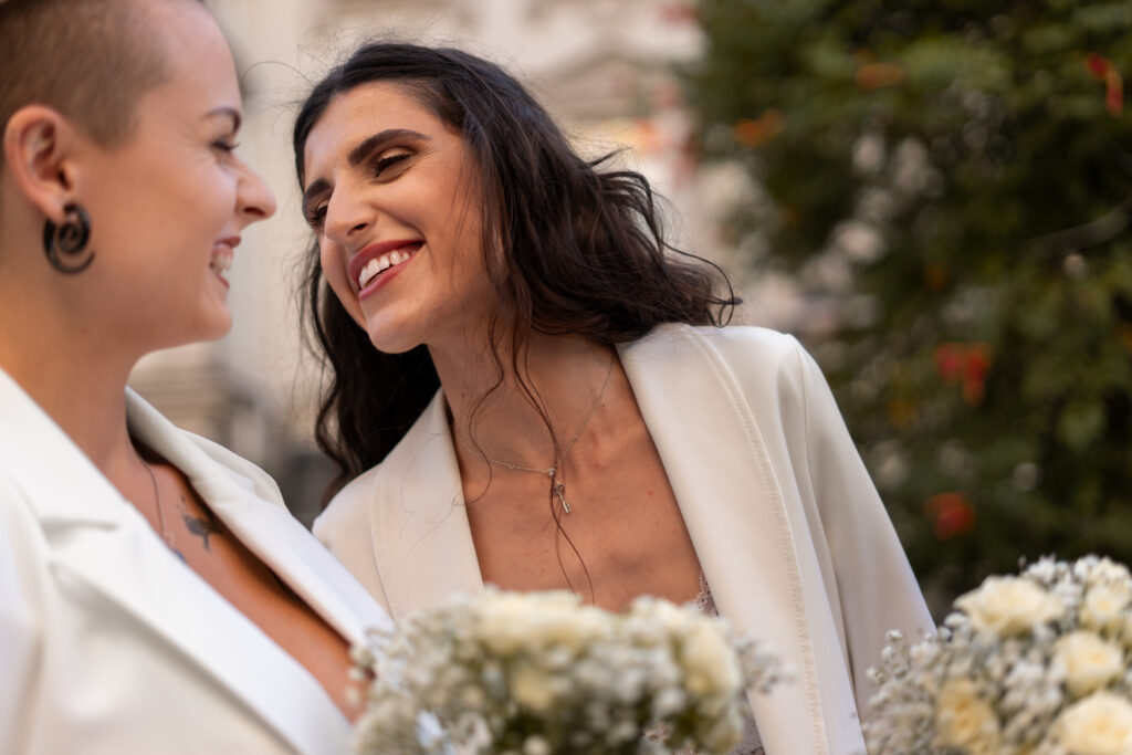 Bride and Bride smiling at each other on their wedding day. The Latest Photography Trends in Wedding Photography