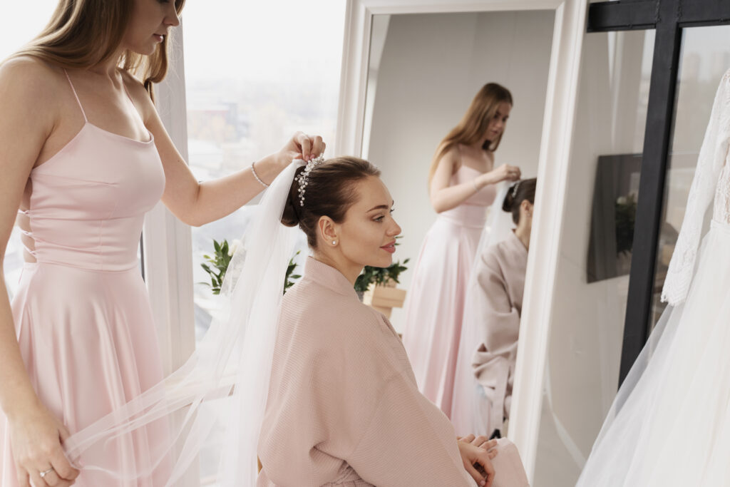 bride getting ready and putting veil on 