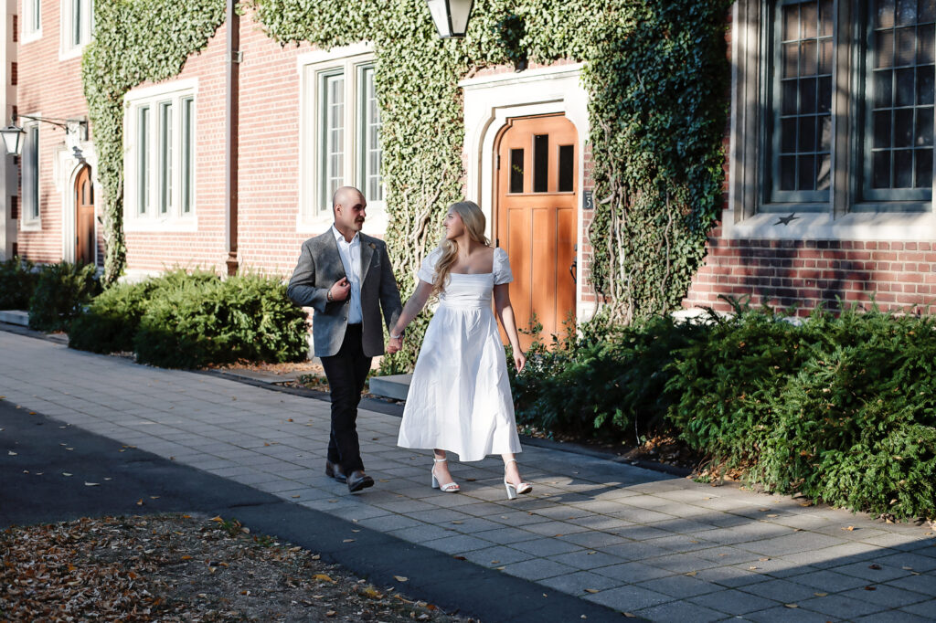 couple walking on campus at their princeton university engagement session