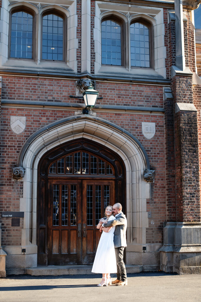 couple hugging at their princeton university engagement session