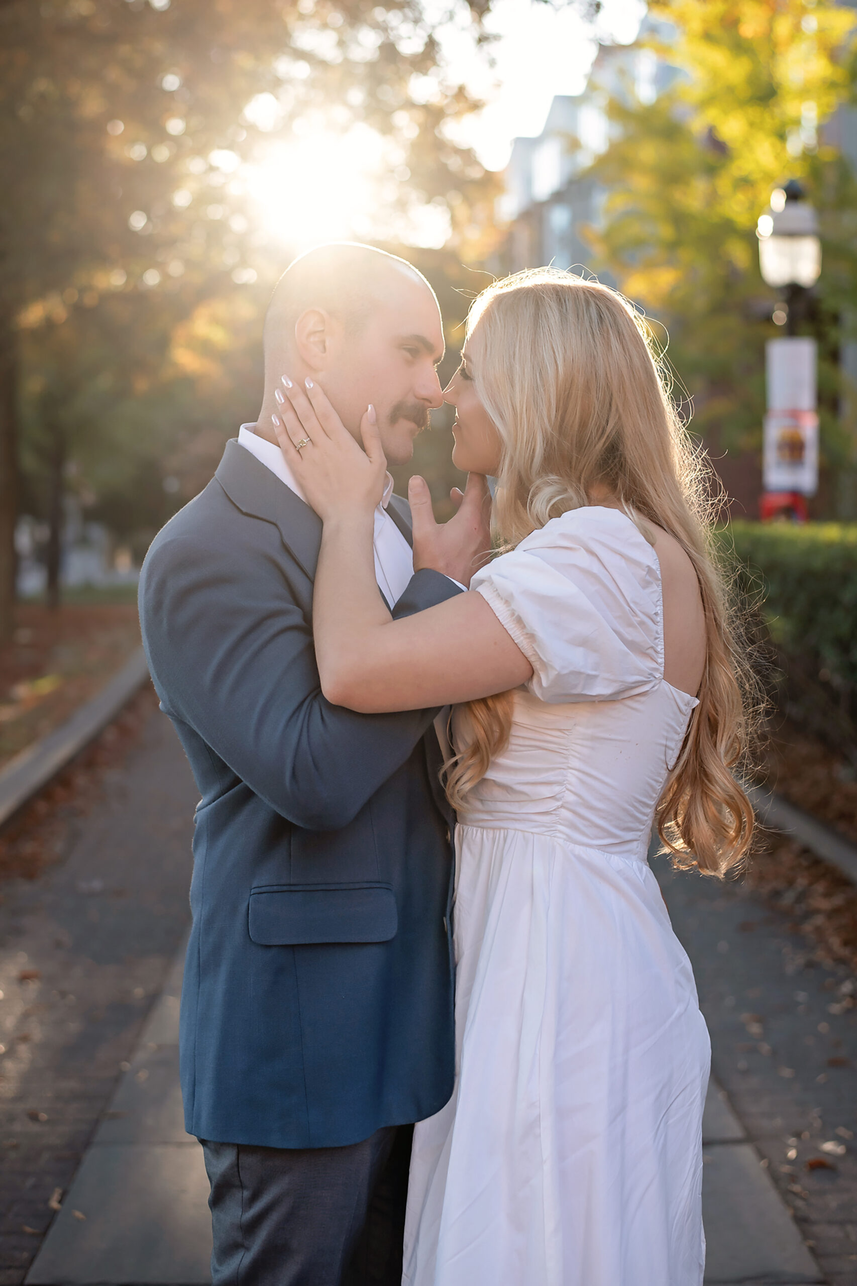 couple going nose to nose at their princeton university engagement session