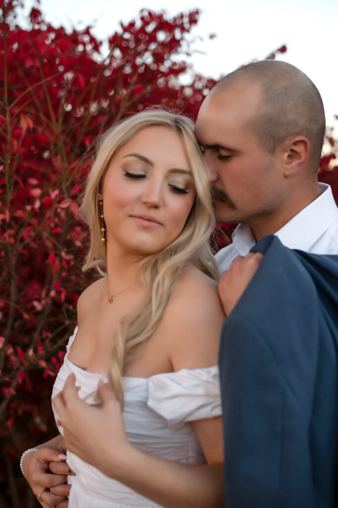 guy smelling girls ear