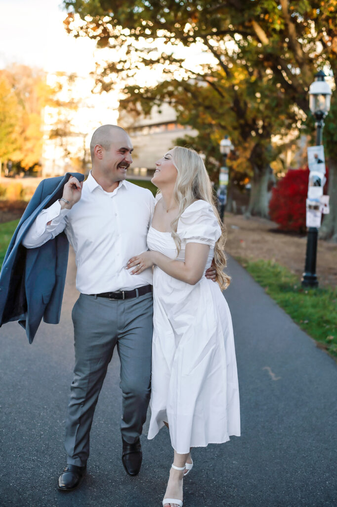 happy couple walking arm in arm