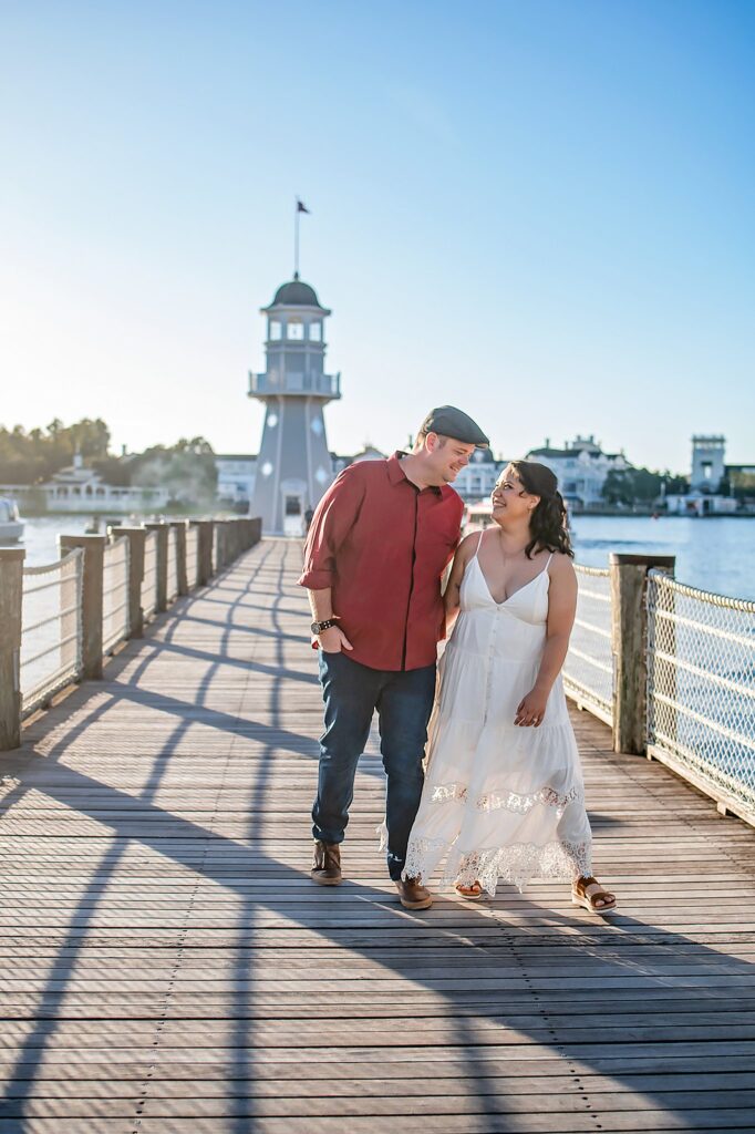 couple walking and laughing at their Disney Engagement Photos Orlando engagement photographer