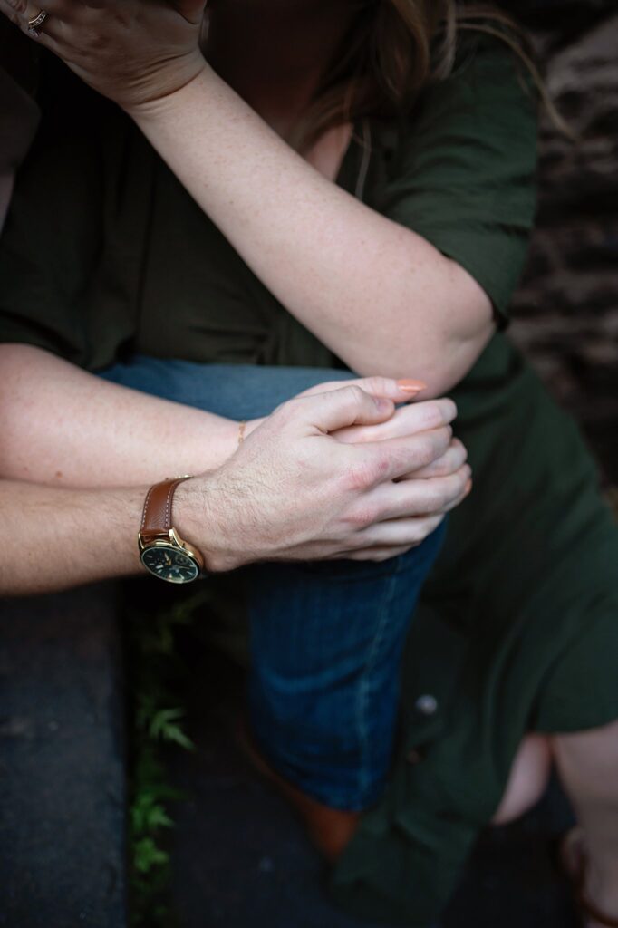 holding hands at their engagement session