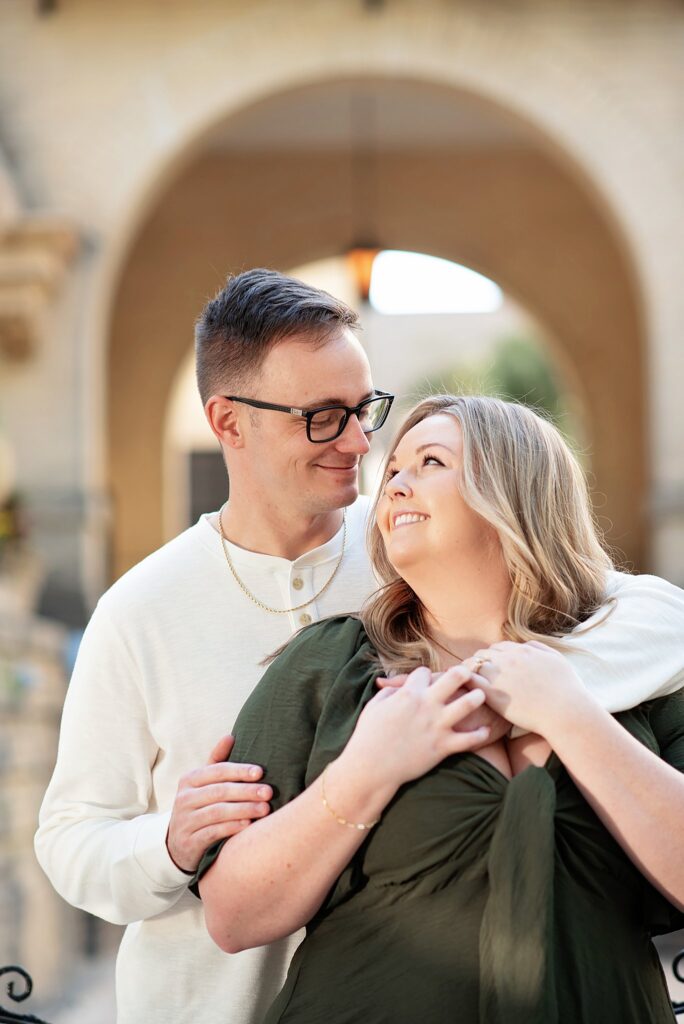 couple looking at each other savannah georgia at their engagement photos